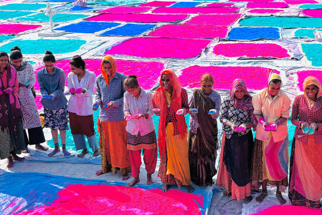 Women workers at an Indian gulal factory packaging colour powder